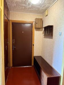 a large door in a room with aartments at Apkalna Retro Apartment in Ventspils +10 photos