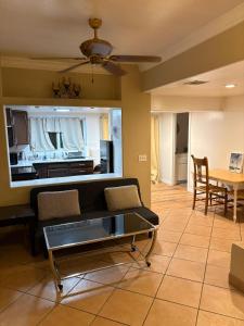 a living room with a couch and a table at CRYStALZ pool studio kitchen DWNtWN stadiums arts in Phoenix