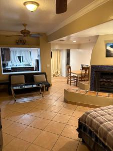 a living room with a couch and a fireplace at CRYStALZ pool studio kitchen DWNtWN stadiums arts in Phoenix