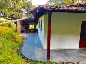 a porch of a house with a patio at Sitio Viração in Bonito