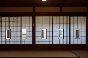 a room with doors with pictures on the wall at Tokyo Sake House in Ome +99 photos