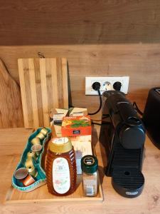 a table topped with a coffee maker and food at Transylvantures Cabin in Rimetea