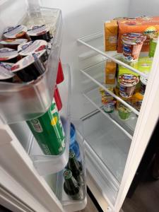 an open refrigerator filled with lots of food and drinks at Casa C&S in Mascali