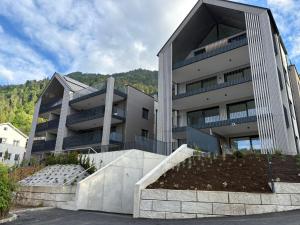 a large building with a garden in front of it at Lakeside Garden Ossiacher See in Sattendorf +14 photos