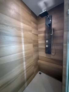 a bathroom with wooden walls and a shower at Del Mare Bangsaley condo in Bang Sare +13 photos