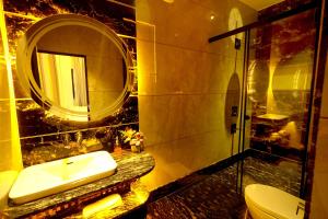 a bathroom with a sink and a mirror at Aman Homestay, A Boutique Hotel in Agra +35 photos