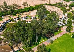 an overhead view of an apartment complex with trees at Kankay Hotel y Centro de Convenciones in Cieneguilla