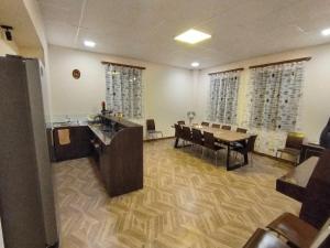 a large dining room with a table and chairs at Tsaghkadzor Family Rest in Tsaghkadzor