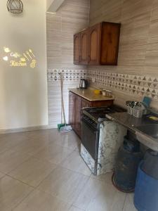 a kitchen with a counter and a stove in it at White Bay Ras Sedr وايت باي راس سدر in Ras Sedr +3 photos