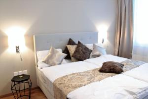 Postel nebo postele na pokoji v ubytování Boutique Hotel Moosegg
