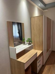a bathroom with a sink and a mirror at MARIALENA HOMe in Petropiyí +54 photos