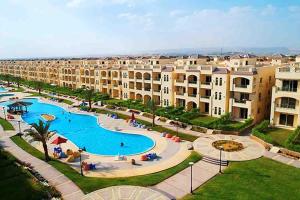 an aerial view of a resort with a swimming pool at Rahaf palm beach chalet in Ain Sokhna