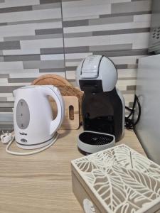 a coffee maker and a mixer on a table at Apartman Lidija in Pag