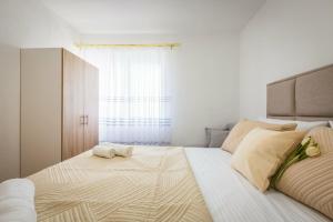 a bedroom with a large bed with two pillows on it at Markovi A&V in Gevgelija