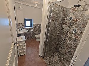 a bathroom with a shower and a toilet and a sink at Il Tanaceto in Castiglione di Sicilia +45 photos