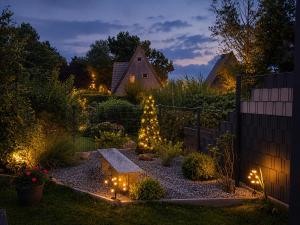 a garden at night with lights in a yard at Zwischen Schlei & Ostsee in Kappeln +35 photos