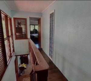 a hallway of a house with a staircase and a room at coubaril Manor in Castries