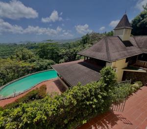 an aerial view of a house with a swimming pool at coubaril Manor in Castries