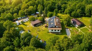 an aerial view of a large building in the middle of a forest at Koča sredi gozda in Kanal