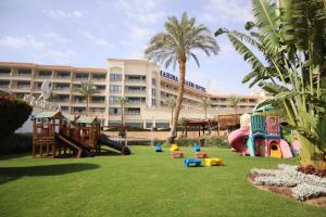 a playground in front of a large building at Marina Sharm Hotel in Sharm El Sheikh