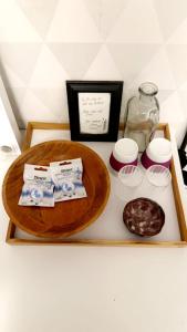 a tray with soap and other items on a table at The Creative Studio Apartment in Piteå +2 photos
