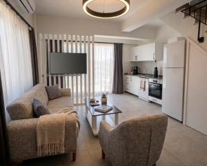 a living room with a couch and a table at Aera Villas - Kaş in Kaş
