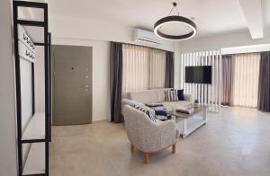 a living room with a couch and a table at Aera Villas - Kaş in Kaş