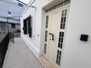 a white door on the side of a building at La Terrazza in Ortona