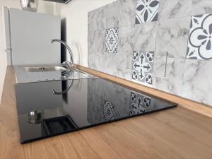 a kitchen with a sink and a counter top at La Terrazza in Ortona