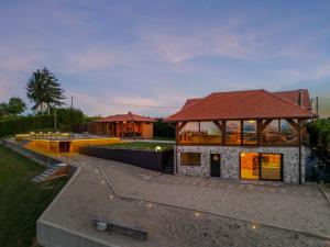 a building with a red roof on top of it at Holiday Residence Banfi in Štrigova