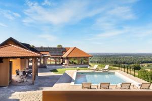 an image of a house with a swimming pool at Holiday Residence Banfi in Štrigova