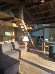 a living room with a couch and a table at Can Cirili Rustic Romantic apartment for couples or family events in Bordils