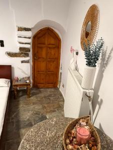 a room with a door and a table with a bowl at Dukes place in Mestá +5 photos