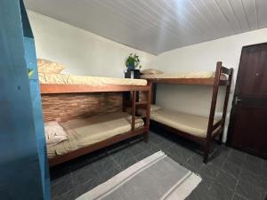a room with two bunk beds in a room at Vista Surf Pipa Hostel in Pipa +13 photos