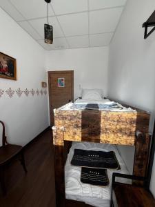 a bedroom with a bed with a wooden frame at El Palmar in Tobarra