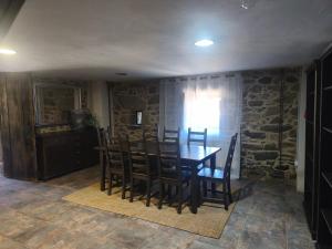 a dining room with a table and chairs at Casa Pancha in Cerdeda