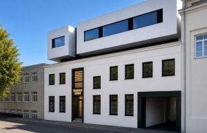 an external view of a white building at Filosoofi Suites in Tartu