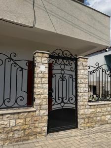 an entrance to a house with a black gate at Tirana Terminal Stay in Tirana