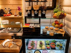 a display of food on a counter in a restaurant at Urban Budget Hotel- Unique Boutique Hotel on Best Location in Vienna