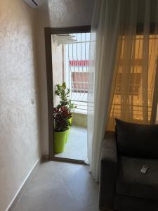 a living room with a couch and a window at اقامة هبة 4 in Yebha
