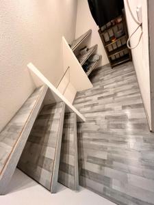 a staircase with a floor made out of wood at Zimmer heilbronn in Heilbronn +1 photo