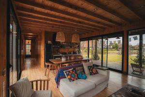 a living room with a couch and a table at Cozy Premium Delta Cabin Private Dock in Tigre