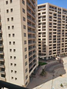 an aerial view of two tall buildings at Winner house in Oran