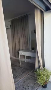 a room with a white bench and a mirror at Djerba Moon in Djerba +24 photos