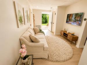 a living room with a couch and a rug at Elegant Boutique Stay in Lilburn