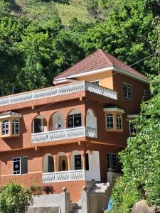 a house on the side of a mountain at Skyview Palace in Morant Bay