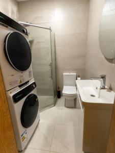 a small bathroom with a sink and a microwave at Mos House in Kobuleti +33 photos
