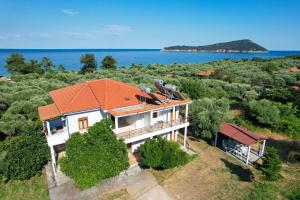 an aerial view of a house with an orange roof at Athina Villa in Koinyra +34 photos