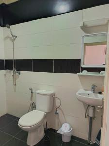 a bathroom with a toilet and a sink at Résidence Zaouit Aglou in Aglou +32 photos