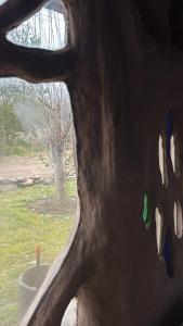 a view through a window of a object with paint on it at Casa Madre in Villa Yacanto